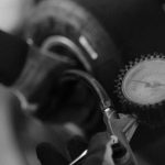 Tire Pressure - Checking Kart Tire Pressure in Black and White