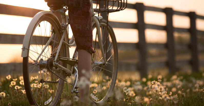 Biking - Person Riding Bicycle Near Fence