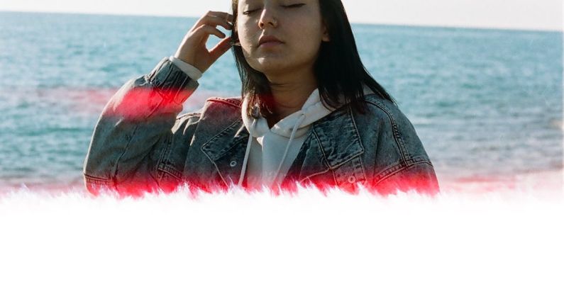 Leaks - Cute Teenage Girl Standing by the Sea