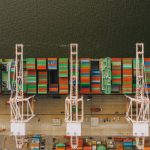 Water System - Colorful cargo containers on ship near pier