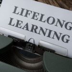 Upgrades - A typewriter with the word long life learning on it