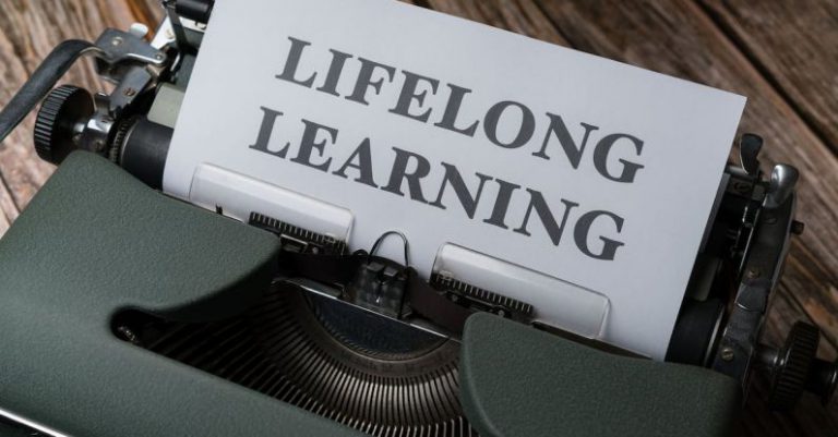 Upgrades - A typewriter with the word long life learning on it