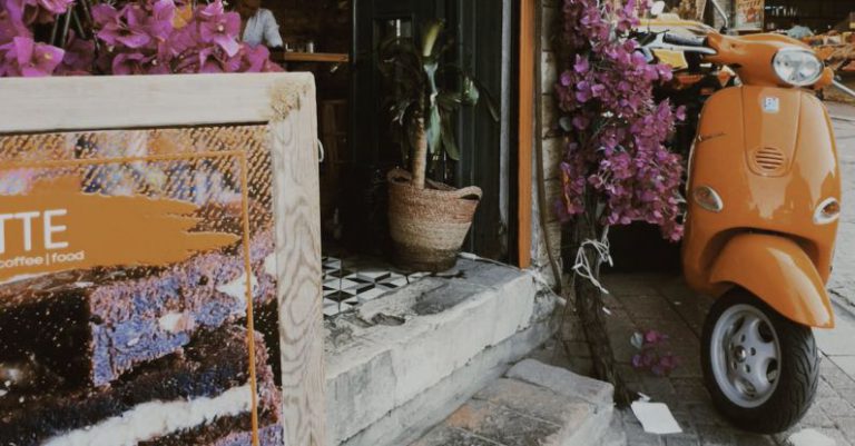 Perks - Vespa near Entrance Decorated with Flowers