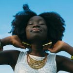 Outdoor Accessories - Woman Wearing White Sleeveless Lace Shirt